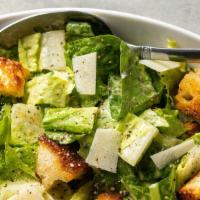 Caesar Salad · Fresh romaine greens with parm-shaving and croutons.