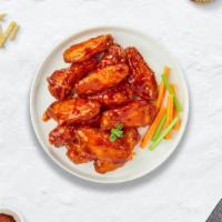 Buffalo Bluffer Wings · Fresh chicken wings breaded, fried until golden brown, and tossed in buffalo sauce. Served w...