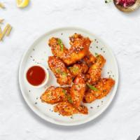 Sweet Tang Wings · Fresh chicken wings breaded, fried until golden brown, and tossed in sweet and sour sauce. S...