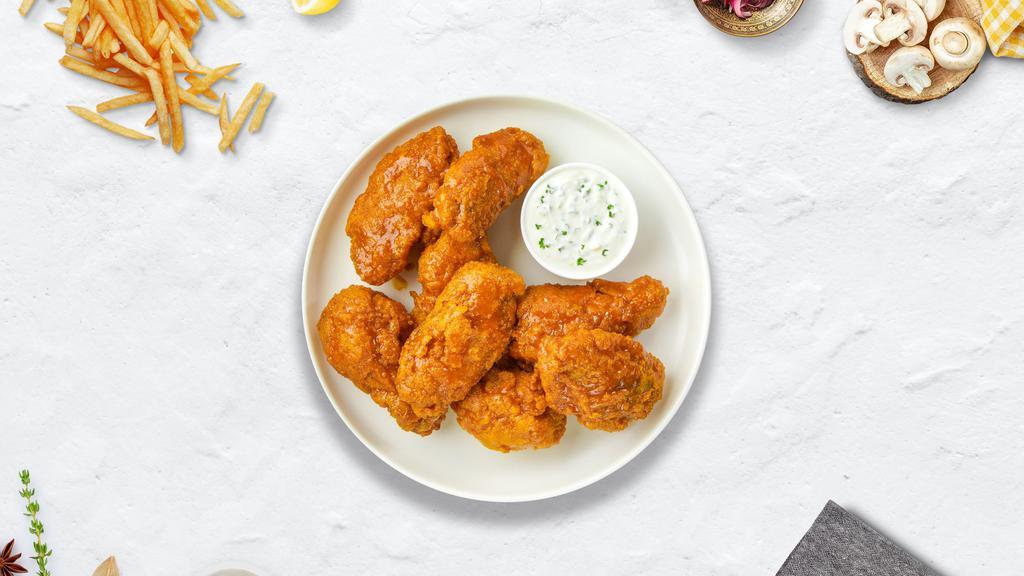 Mango Habanero Wings · Fresh chicken wings breaded, fried until golden brown, and tossed in mango habanero sauce. Served with a side of ranch or bleu cheese.