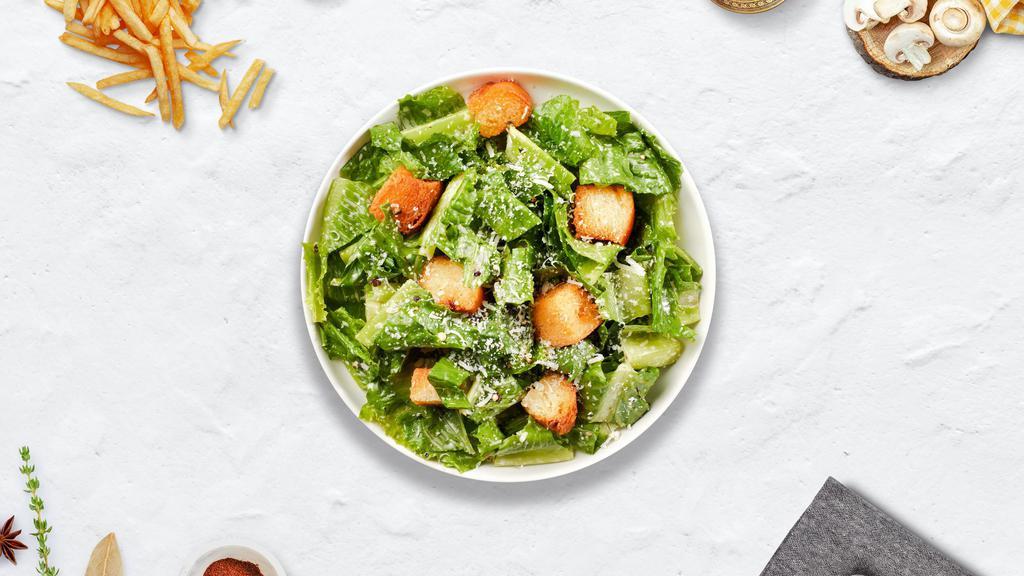 Caesar Salad · (Vegetarian) Romaine lettuce, house croutons, and parmesan cheese tossed with Caesar dressing.