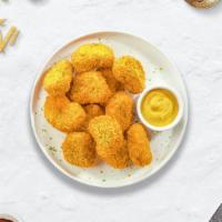 Chicken Nuggets · Bite sized nuggets of chicken breaded and fried until golden brown.