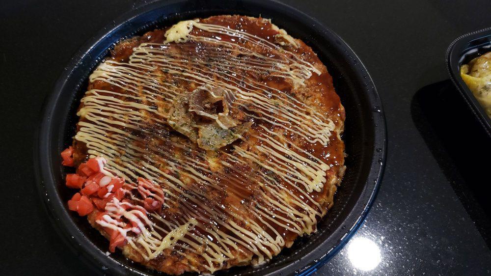 Okonomiyaki · Japanese savory pancakes. Cabbage, egg, tempura flakes, ginger, flour.