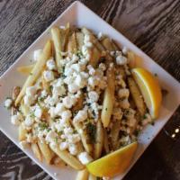 Greek Fries · Hand-cut fries, topped with feta cheese and oregano.