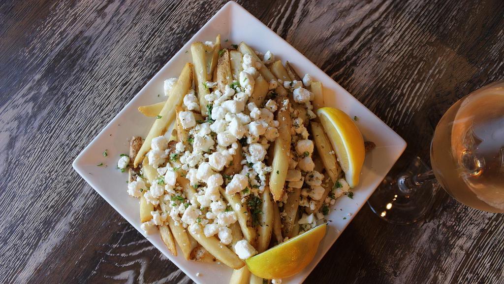 Greek Fries · Hand-cut fries, topped with feta cheese and oregano.