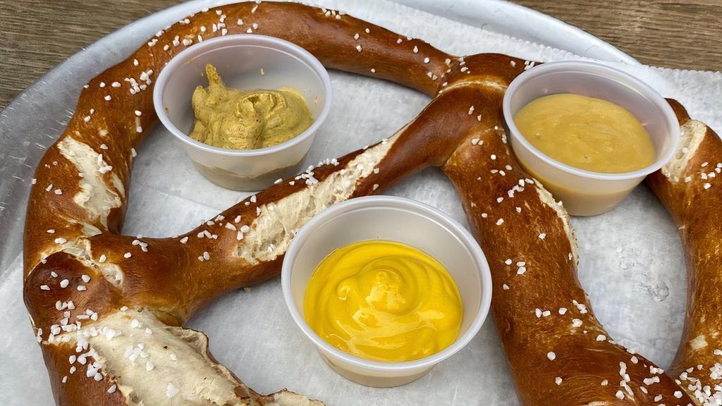 Bavarian Pretzel · Served with artisan mustard dipping sauces.
