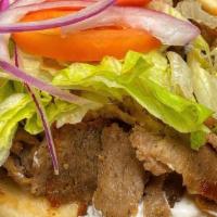 Gyro Sandwich · Seasoned beef and lamb, slow-roasted and carved off the rotisserie, wrapped in warm pita bre...