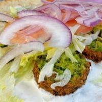 Falafal Sandwich · Finely ground chickpeas, onions, parsley, garlic, and spices; deep-fried into semi-circles, ...