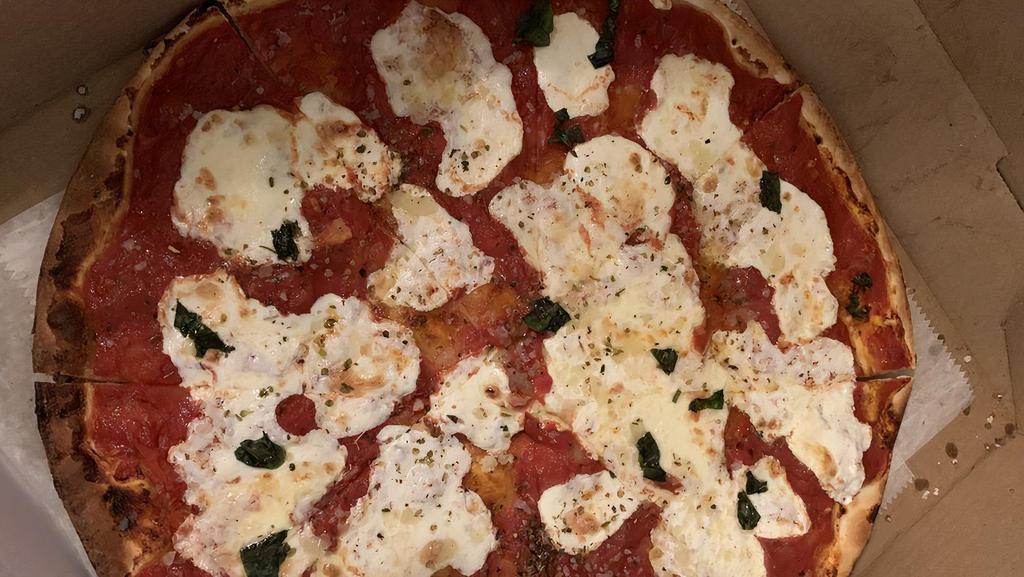 Margherita · Fresh San Marzano tomato, fresh mozzarella, topped with pecorino Romano, extra virgin olive oil, fresh basil, and Italian seasoning.