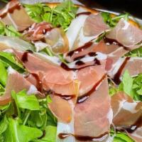Prosciutto Arugula Balsamic · Thin crust pizza topped with sliced prosciutto, crispy arugula, and drizzled with a balsamic...