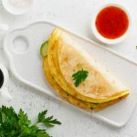 Simple Omelet Roll · Delicious omelet with cheese, tomatoes, onions, and peppers.