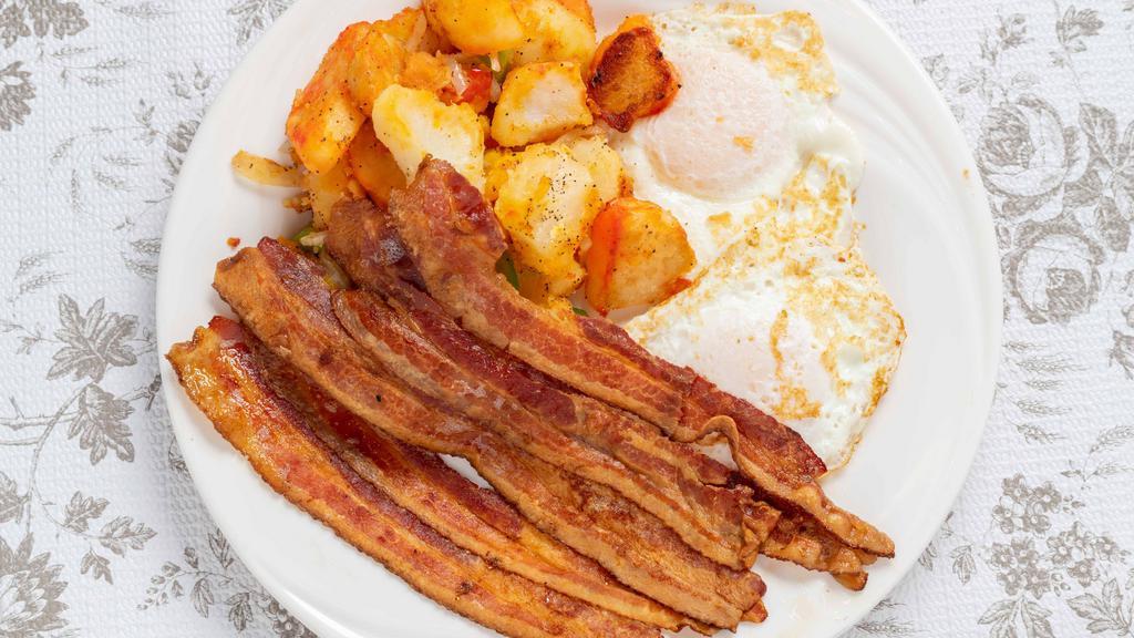 2 Eggs Platter With Meat · Served with home fries and choice of toast.
(meat choice bacon, sausage, ham, or turkey )