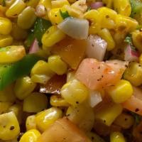 Street Corn Salad · Toasted whole kernel yellow corn with peppers, tomato, red onion, cilantro, lime, and spices...