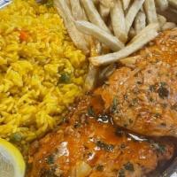 Chicken In Garlic Sauce · Breaded Chicken served over a brown garlic sauce with spanish fries and rice