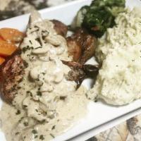 Pork Chops W Mushroom Sauce · 2 grilled pork chops , served with a cream of mushrooms with broccoli and mash potato
