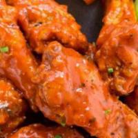 Buffalo Wings · Eight pieces served with bleu cheese dressing.