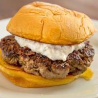 Lamb Burger · Fresh ground lamb, seasoned with fresh herbs and spices and topped with house-made tzatziki.