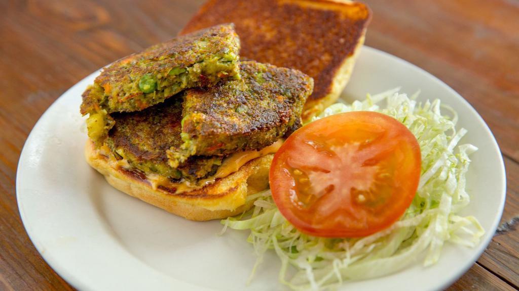 Veggie Burger · Vegetarian. Served with lettuce, tomato and two8two sauce.