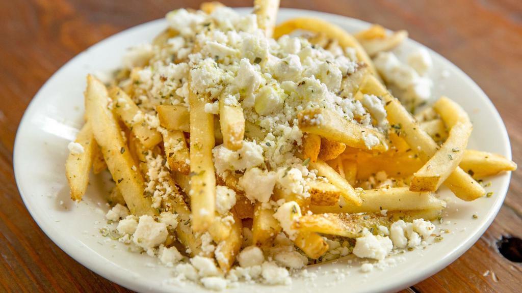 Greek Fries · Topped with feta cheese and oregano.