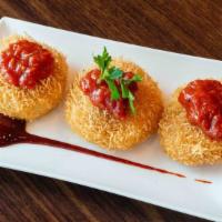 Dahi Ke Kabab · Yogurt dumpling coated with vermicelli and served with tomato chutney.