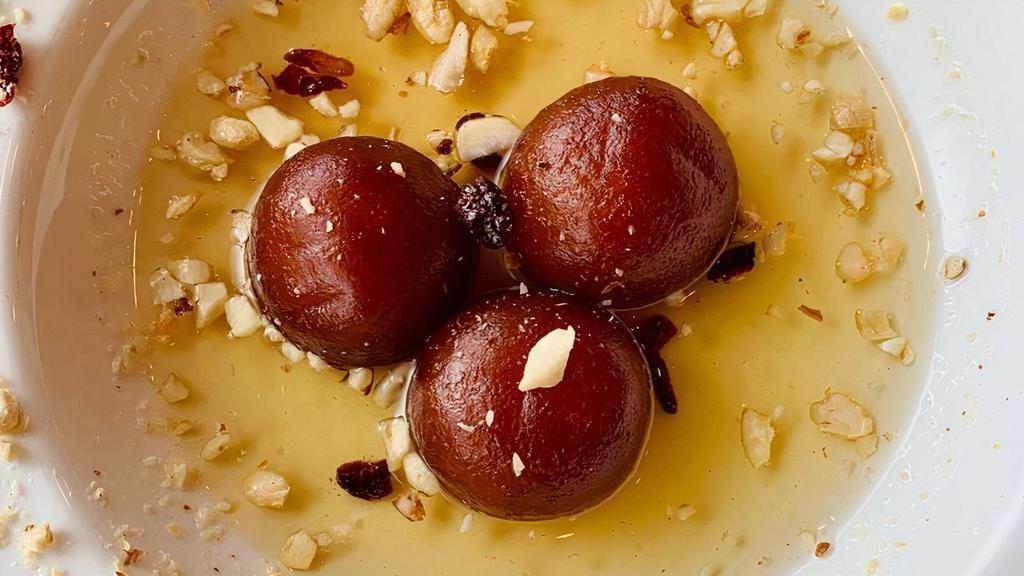 Gulab Jamun · Milk pastry balls served in a rose and honey syrup.