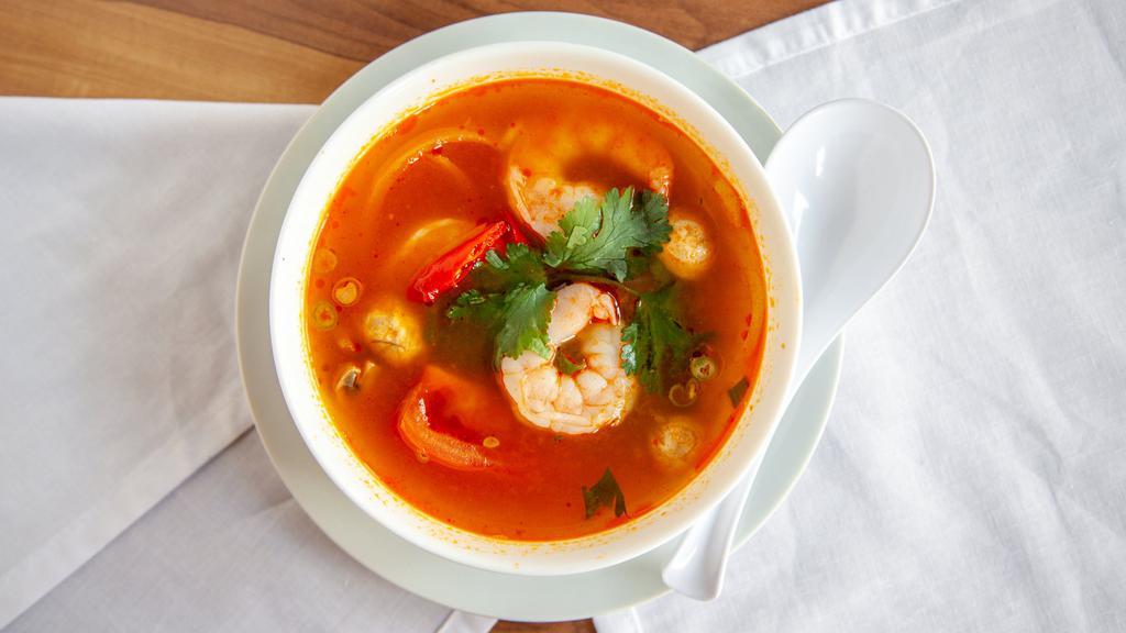 Tom Yum Soup · Spicy. Choice of chicken or tofu in tom yum flavored soup with lemongrass, galangal root, kaffir lime leaf, onion, mushroom, tomato, cilantro, and scallion. Add shrimp and seafood for an additional charge.