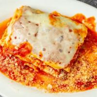 Lasagna · Baked layers of sheet pasta homemade tomato & meat sauce ricotta and mozzarella cheese