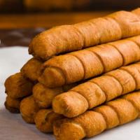 Tequenos (3) · Fried cheese bread (3 per order)