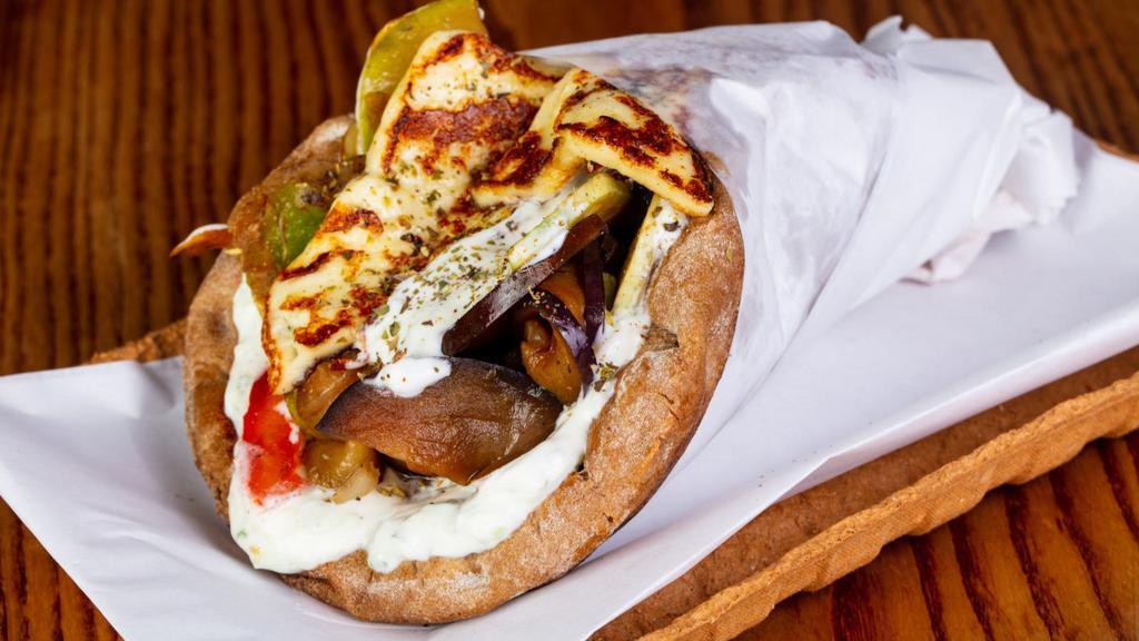 Bbq & Veggie Pita Sandwich · Flavorful Grilled Veggies Mixed with BBQ Sauce, Tzatziki sauce, Diced Tomatoes in a homemade pita bread.