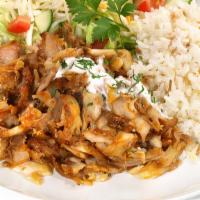 Chicken Over Rice · Marinated Chicken added to delicious stir fried rice. Topped with diced tomatoes, thinly sli...