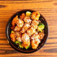 Sesame Chicken · Chunks of chicken meat lightly fried with broccoli and sauteed in sesame sauce. Served with ...