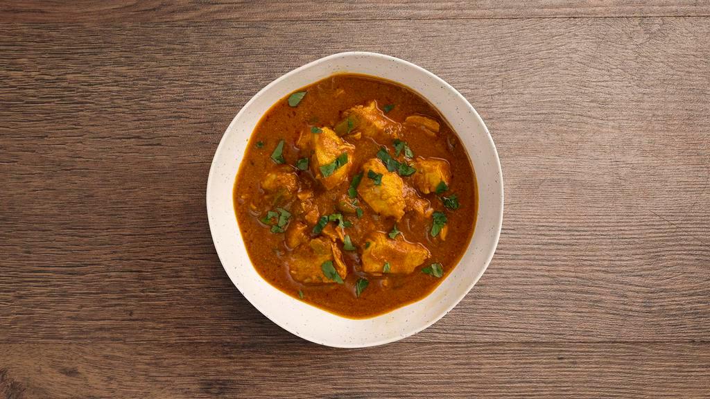 Chicken Madras · Chicken cooked with cumin, coriander, turmeric, with a hearty tomato based sauce.