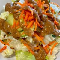 House Side Salad · A simple, yet delicious, side salad of chopped lettuce, cucumbers and diced carrots served w...
