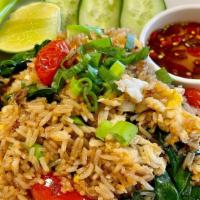 Basil Fried Rice / Khao Pad Horapa · Fried rice with Thai basil, tomatoes, eggs, garlic, Chinese broccoli, topped with scallions.