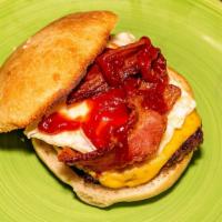 Wake Up Burger · Angus beef with American cheese topped with a sunny side up egg, bacon and ketchup.