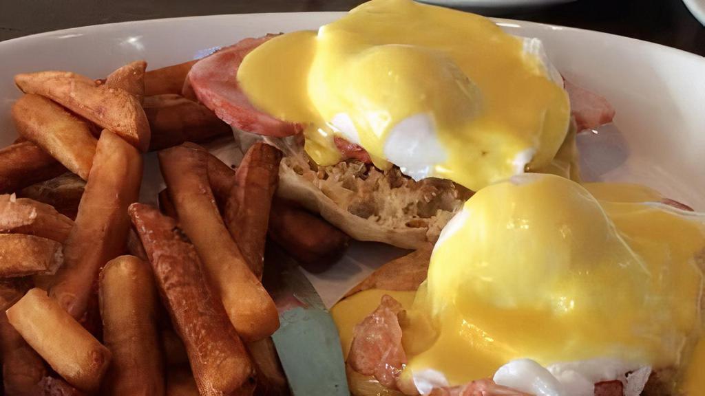 Egg Benedict · Two poached eggs with Canadian bacon on an English muffin with hollandaise sauce