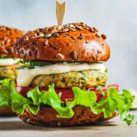 Vegetable Burger · Served with lettuce, tomatoes, and french fries.