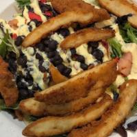 Southwest Salad · Spring mix with garden mix vegetables, corn, black beans, and crisp tortilla strips. Topped ...