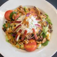 Chicken Apple Walnut Salad · California mixed greens, tomatoes,
cucumbers & carrots topped with chunky
chicken salad, sli...