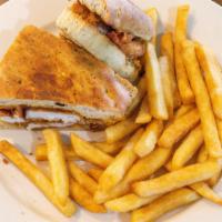 Bbq Panini · Bbq grilled chicken with grilled onions and bacon. Served with french fries.