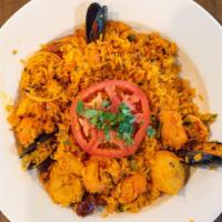 Paella Valenciana · Yellow rice with scallops, shrimp, mussels, clams,
chorizo & chicken