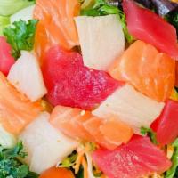 Sashimi Salad · Assorted diced sashimi, organic spring mix, lettuce, cherry tomatoes, carrot, cucumber and s...