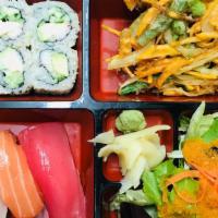 Sushi Bento Box · Sushii Bento Box, california roll, veggie kakiage, side salad. Comes with miso soup.