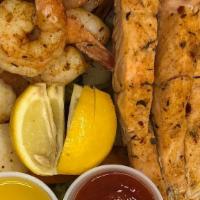 Seafood Combo (Grilled) · Half pound salmon, Ten  pieces shrimps, Eight  pieces scallops and mix vegetables (Onion, Po...