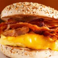 Bacon, Egg & Cheese Sandwich · Delicious Breakfast sandwich topped with 2 cooked eggs, crispy bacon, and melted cheese. Ser...