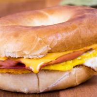 Ham, Egg & Cheese Sandwich · Delicious Breakfast sandwich topped with 2 cooked eggs, ham, and melted cheese. Served on cu...