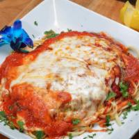 Eggplant Parmigiana · Lightly battered skinless eggplant covered with tomato sauce and mozzarella.