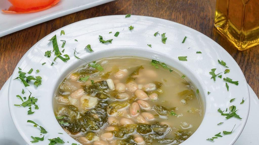 Escarole & Bean Soup · Sautéed escarole and cannellini beans in a light broth with garlic and olive oil.