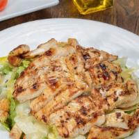 Chicken Caesar Salad · Marinated grilled chicken, romaine lettuce, croutons, shaved Parmesan, and Caesar dressing.