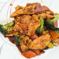Chicken With Broccoli · Sliced white meat chicken with broccoli carrots and onions stir fried in a brown sauce. serv...